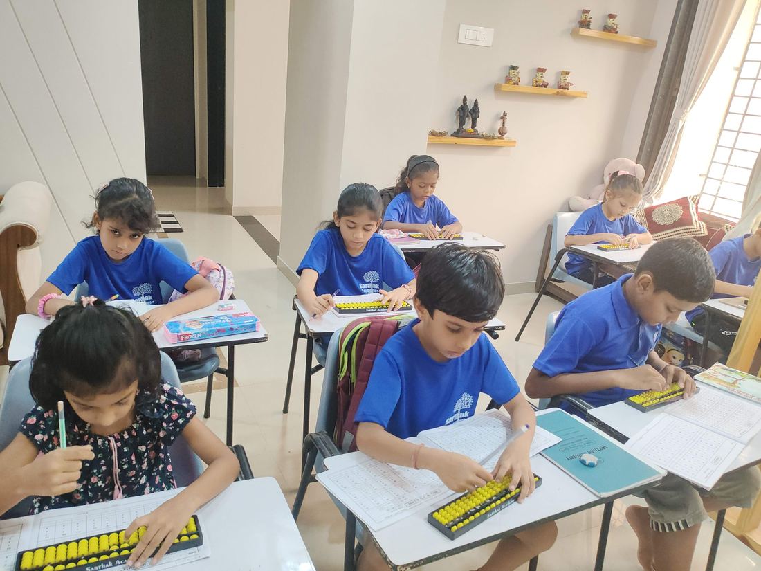 Students practising on the abacus in class at Sarthak Academy, Vasai East