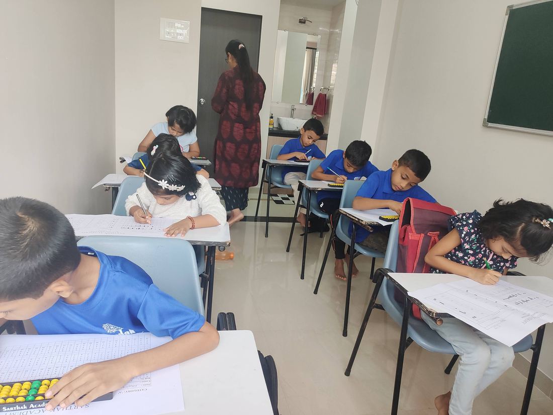Students writing the Sarthak Academy annual abacus competition