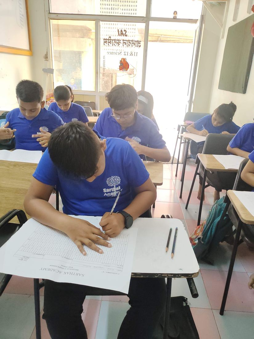 A student working through the abacus competition paper